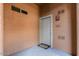 Apartment entrance featuring a neutral door, unit number, and welcome mat at 11500 E Cochise Dr # 1094, Scottsdale, AZ 85259