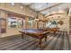 Spacious game room with two pool tables, pendant lighting, and windows bringing natural light at 11500 E Cochise Dr # 1094, Scottsdale, AZ 85259