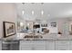 Open kitchen with granite counters, stainless appliances, and views into the living room at 11500 E Cochise Dr # 1094, Scottsdale, AZ 85259