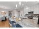 Kitchen with white cabinets, granite counters, stainless appliances, and seating at the island at 11500 E Cochise Dr # 1094, Scottsdale, AZ 85259