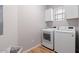 Laundry room featuring a washer and dryer and upper cabinets at 11500 E Cochise Dr # 1094, Scottsdale, AZ 85259