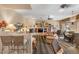 Inviting living room with multiple seating areas, a fireplace, and large windows for natural light at 11500 E Cochise Dr # 1094, Scottsdale, AZ 85259