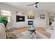 Cozy living room with a fireplace, a ceiling fan, and plush seating at 11500 E Cochise Dr # 1094, Scottsdale, AZ 85259