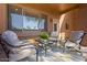 Outdoor patio area with comfortable seating and a table, perfect for relaxation and enjoying the outdoors at 11500 E Cochise Dr # 1094, Scottsdale, AZ 85259