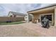Backyard patio with built in outdoor kitchen area, RV parking, and artificial grass at 1189 E Tyler Ln, Casa Grande, AZ 85122