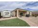 The backyard features a covered patio and is fully fenced at 1189 E Tyler Ln, Casa Grande, AZ 85122
