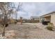 Large backyard featuring desert landscaping, a covered patio, and ample space for outdoor activities at 1189 E Tyler Ln, Casa Grande, AZ 85122