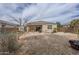 Wide shot of backyard with patio, rv parking, and landscaping at 1189 E Tyler Ln, Casa Grande, AZ 85122