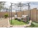 Backyard oasis featuring comfortable seating and shade at 1189 E Tyler Ln, Casa Grande, AZ 85122