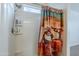 Bright shower with tile surround and a shower curtain at 1189 E Tyler Ln, Casa Grande, AZ 85122