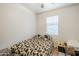 Cozy bedroom featuring a large bed and natural light from the window at 1189 E Tyler Ln, Casa Grande, AZ 85122