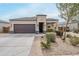 Inviting single-Gathering home boasting desert landscaping, a two-car garage and a beautifully designed facade at 1189 E Tyler Ln, Casa Grande, AZ 85122