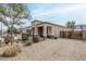 A charming single-Gathering residence with a well-maintained yard featuring desert landscaping and private gate at 1189 E Tyler Ln, Casa Grande, AZ 85122