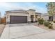 Charming single-story home featuring a two-car garage, desert landscaping, and a welcoming front porch at 1189 E Tyler Ln, Casa Grande, AZ 85122