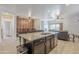 Spacious kitchen island featuring granite countertops, stainless steel appliances, and ample storage space at 1189 E Tyler Ln, Casa Grande, AZ 85122