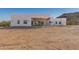 Back of a modern home with a covered patio perfect for outdoor entertaining at 14902 W Oberlin Way, Surprise, AZ 85387