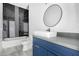 Bathroom showcasing modern fixtures, including a vessel sink and tiled shower and bathtub combination at 14902 W Oberlin Way, Surprise, AZ 85387