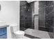 Luxurious bathroom features modern fixtures, a sleek vessel sink, and a sophisticated black tiled shower at 14902 W Oberlin Way, Surprise, AZ 85387