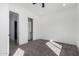 Bright bedroom features neutral walls, plush carpeting, and an open closet providing ample storage space at 14902 W Oberlin Way, Surprise, AZ 85387