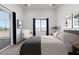 Cozy bedroom with artwork, a chair, a window view, and comfortable bedding at 14902 W Oberlin Way, Surprise, AZ 85387