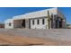 Contemporary home featuring clean lines, desert landscaping, and striking curb appeal at 14902 W Oberlin Way, Surprise, AZ 85387