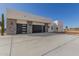Modern home exterior with three-car garage and sleek design at 14902 W Oberlin Way, Surprise, AZ 85387
