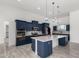 Beautiful kitchen featuring custom cabinetry, stainless steel appliances, and a large central island at 14902 W Oberlin Way, Surprise, AZ 85387
