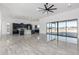 Open concept living area with tile floors and large sliding glass doors, leading to outdoor space at 14902 W Oberlin Way, Surprise, AZ 85387