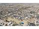 Community aerial view featuring numerous residences and streets in a well-planned neighborhood and desert landscape at 1559 E Peregrine Trl, Casa Grande, AZ 85122