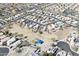Picture of a planned neighborhood featuring numerous streets and homes with desert and a park in foreground at 1559 E Peregrine Trl, Casa Grande, AZ 85122