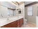 Well-lit bathroom featuring double sinks and separate shower at 1559 E Peregrine Trl, Casa Grande, AZ 85122