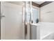 Bright bathroom featuring a glass shower and a soaking tub with decorative glass block window at 1559 E Peregrine Trl, Casa Grande, AZ 85122
