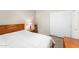 Cozy bedroom with a bed, nightstand, dresser and closet with sliding doors at 1559 E Peregrine Trl, Casa Grande, AZ 85122