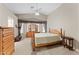 Serene main bedroom featuring a vaulted ceiling, ceiling fan, and plenty of natural light at 1559 E Peregrine Trl, Casa Grande, AZ 85122