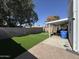 Expansive backyard with artificial turf, covered patio, and perimeter block wall at 17406 N 28Th Dr, Phoenix, AZ 85053