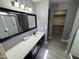 Stylish bathroom featuring a modern vanity with a countertop and a sleek, framed mirror at 17406 N 28Th Dr, Phoenix, AZ 85053