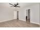 A clean bedroom features neutral walls, baseboards, tile floor and a ceiling fan at 17406 N 28Th Dr, Phoenix, AZ 85053