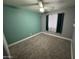 This bedroom features cozy carpet flooring, and ample natural light through a window at 17406 N 28Th Dr, Phoenix, AZ 85053
