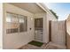 Secure entryway featuring a decorative security door, security system sign and a green welcome mat at 17406 N 28Th Dr, Phoenix, AZ 85053