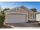 Attractive single-story home showcasing a two-car garage, desert landscaping and a freshly painted exterior at 17406 N 28Th Dr, Phoenix, AZ 85053