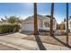 Beautiful single-story home featuring a two-car garage, desert landscaping and mature palm trees along the walkway at 17406 N 28Th Dr, Phoenix, AZ 85053