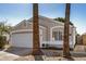 Inviting single-story home featuring a two-car garage, mature palm trees and desert landscaping along the walkway at 17406 N 28Th Dr, Phoenix, AZ 85053