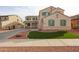 Charming two-story home featuring low-maintenance landscaping with decorative rocks and turf at 17687 W Surrey Dr, Surprise, AZ 85388
