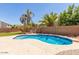 Inviting backyard pool with a well-manicured patio and mature landscaping at 17687 W Surrey Dr, Surprise, AZ 85388