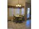 Bright breakfast nook with a dining table set and lots of natural light from windows at 17821 N Woodrose Ave, Surprise, AZ 85374