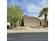 Charming single-story home featuring desert landscaping, a two-car garage, and a private entrance at 17821 N Woodrose Ave, Surprise, AZ 85374