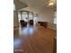 Inviting living room with gleaming hardwood floors, plentiful natural light, and neutral paint at 17821 N Woodrose Ave, Surprise, AZ 85374
