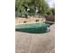 Sparkling pool with a waterfall feature, surrounded by a concrete deck at 17821 N Woodrose Ave, Surprise, AZ 85374