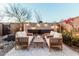 Backyard seating area with a unique fireplace feature and desert-style landscaping at 1936 W Kinfield Trl, Phoenix, AZ 85085