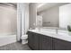 Modern bathroom featuring a double vanity, stylish patterned tile, and shower-tub combination at 1936 W Kinfield Trl, Phoenix, AZ 85085
